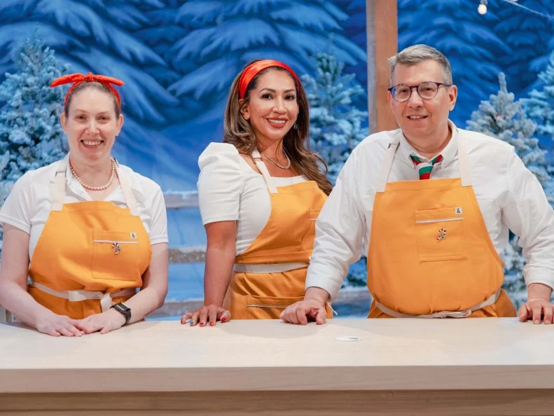 Contestants Angela Cabanyog and Frank LaMendola, Jennifer Moshier, as seen on Holiday Wars, Season 3.