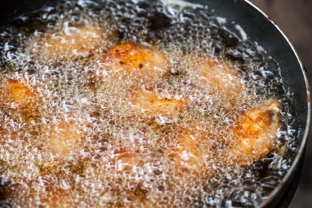 Chicken frying in a pan