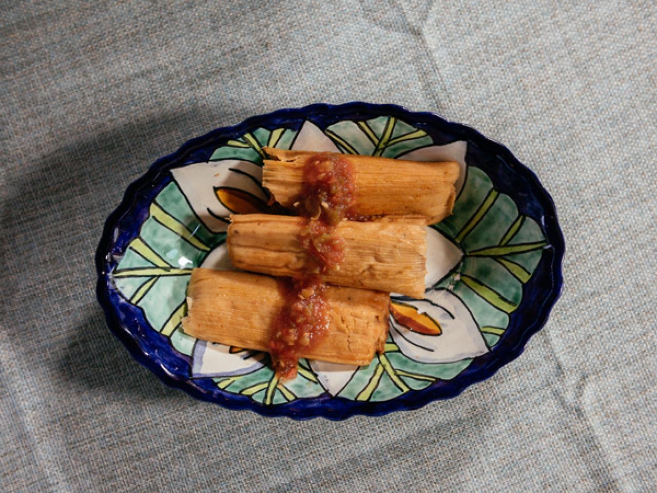 https://food.fnr.sndimg.com/content/dam/images/food/fullset/2021/10/21/FN_tia-chitas-traditional-mexican-pork-tamales-maria-de-jesus-aguirre-tia-chita_s4x3.jpg.rend.hgtvcom.1280.960.suffix/1634839087306.jpeg