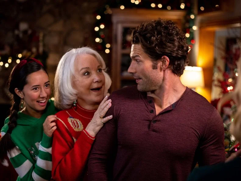 Lee Garlington as Kim Winter, as seen in Candy Coated Christmas, Special. Winter and Aaron O'Connell as Noah Winter and Landry Townsend as Dakota Winter, as seen in Candy Coated Christmas, Special.