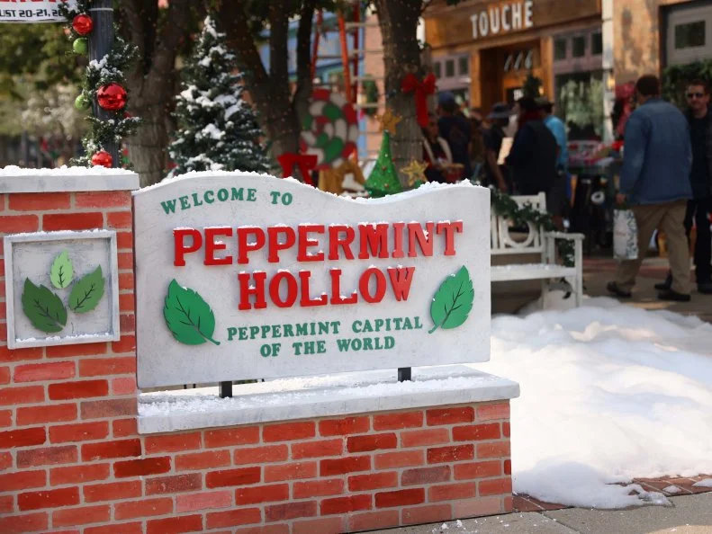 Welcome sign for Peppermint Hollow, as seen on Candy Coated Christmas, Special.
