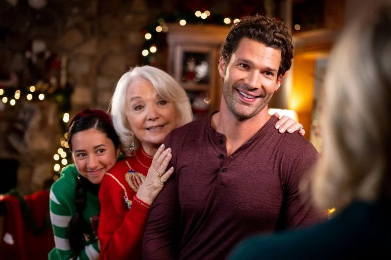 Lee Garlington as Kim Winter, as seen in Candy Coated Christmas, Special. Winter and Aaron O'Connell as Noah Winter and Landry Townsend as Dakota Winter, as seen in Candy Coated Christmas, Special.