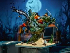 Team Mischievous Monsters’ finished Dueling Monster cake, a thunderbird battles a serpent man, as seen on Halloween Wars, Season 11.