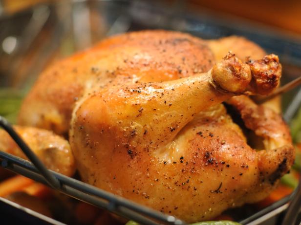 "SEVERAL MORE IN THIS SERIES.  Whole roasted chicken, just out of the oven and still in the roasting pan with a temperature probe.  Very shallow DOF."