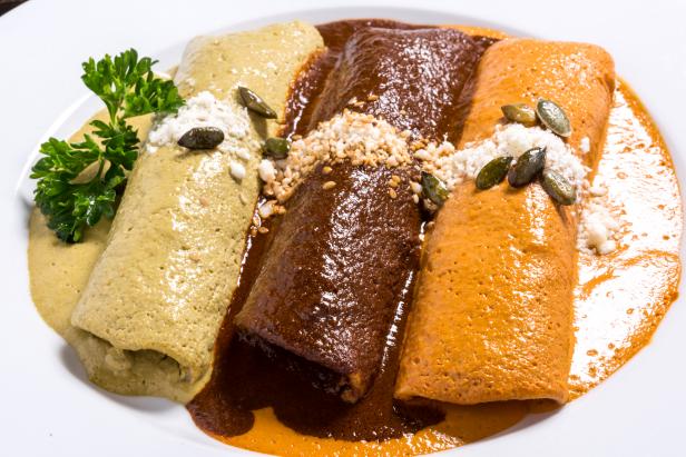 Cheese or Chicken Enchiladas Smothered in mole poblano, red and green pepiÃ¡n, .