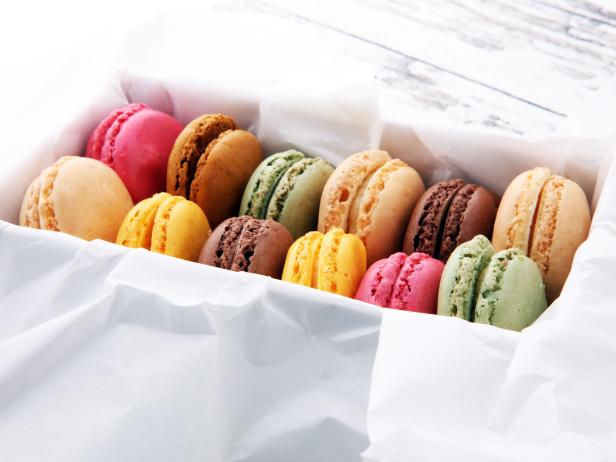 Different types of macaroons or macarons in a box.