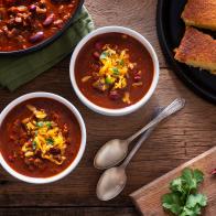 Bowls of Homemade Chili with Corn Bread, Cilantro and Cheddar Cheese
