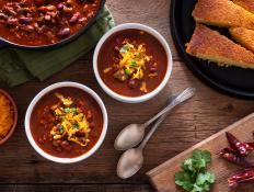 Bowls of Homemade Chili with Corn Bread, Cilantro and Cheddar Cheese