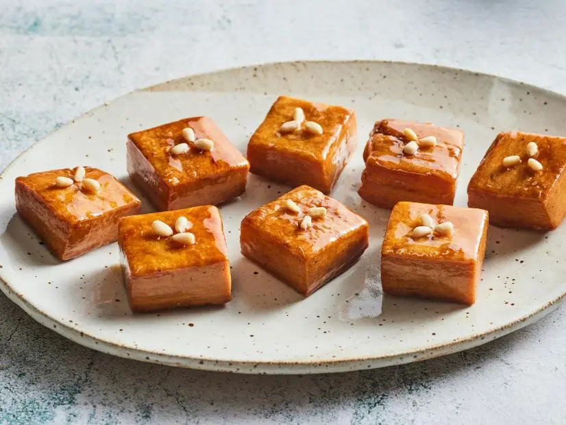 Description: Food Network Kitchen's Yakgwa. Keywords: Sesame Oil, Soju, Jochung, Honey, Sugar, Ginger, Cinnamon, Pine Nuts.