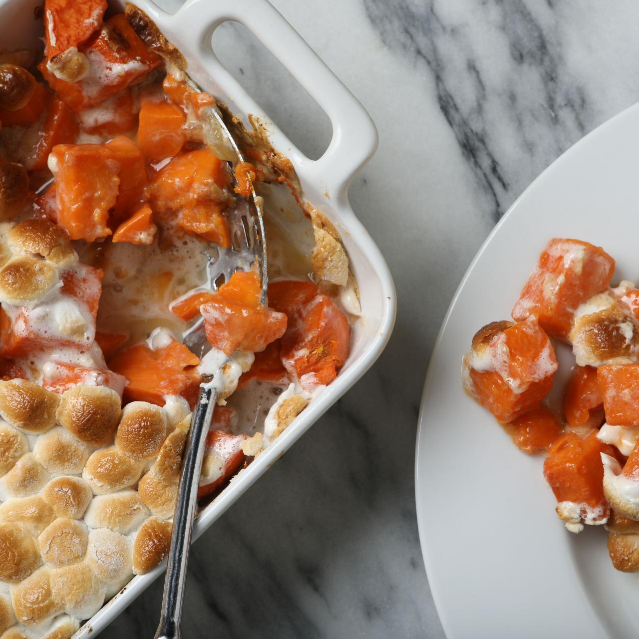 https://food.fnr.sndimg.com/content/dam/images/food/fullset/2021/11/17/sweet-potato-casserole-marshmallows-spoon-plate-marble-surface.jpg.rend.hgtvcom.1280.1280.suffix/1637199912305.jpeg