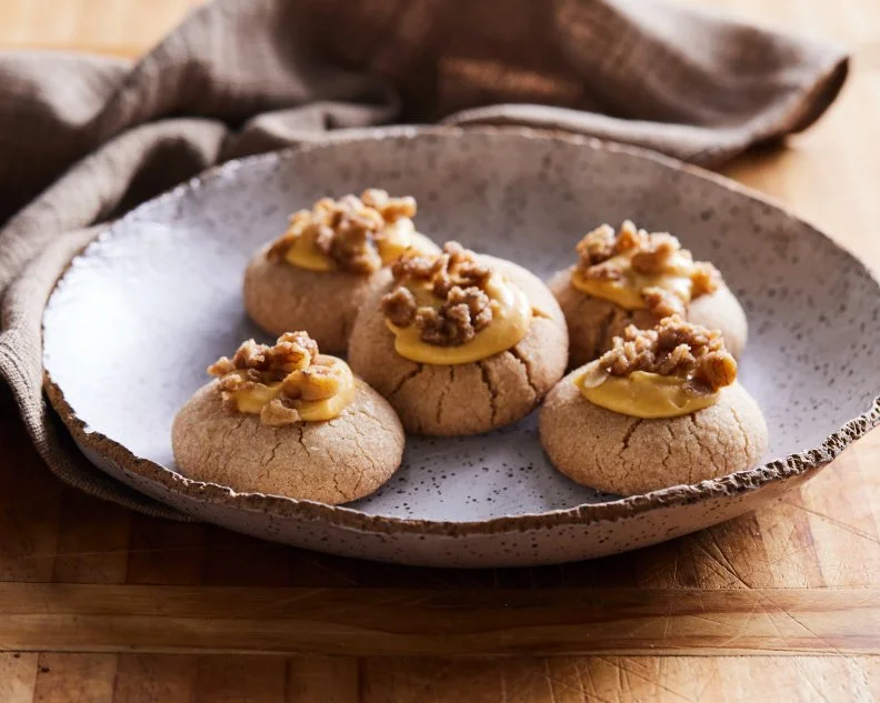 Description: Eddie Jackson's Pumpkin Pie Thumbprint Cookies. Keywords: Pumpkin Pie Spice, Egg, Vanilla Extract, Pecans, Light Brown Sugar, Rolled Oats, Confectioners’ Sugar, Pumpkin Puree, Cream Cheese.