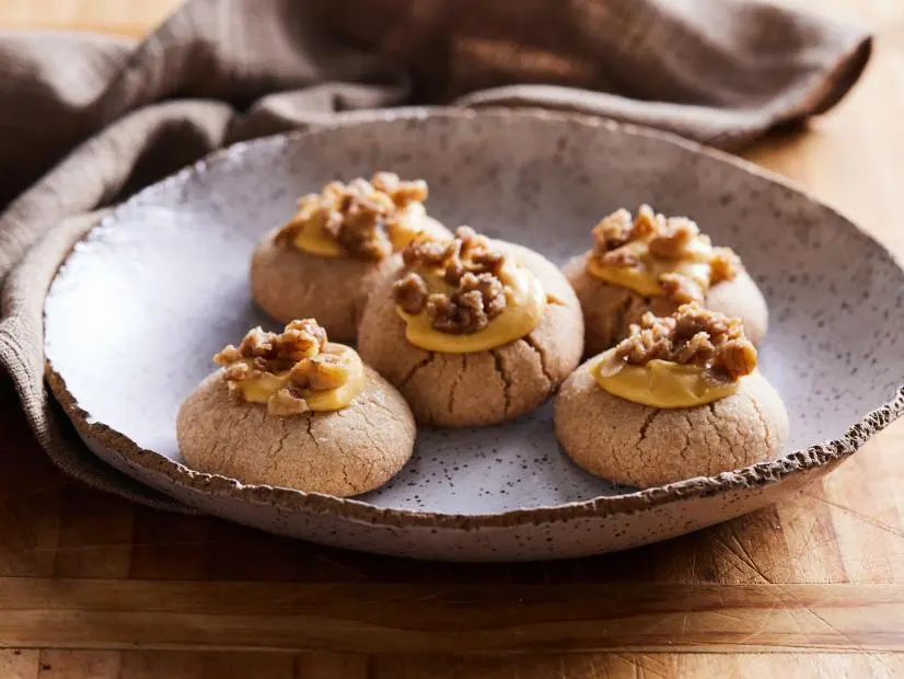 Description: Eddie Jackson's Pumpkin Pie Thumbprint Cookies. Keywords: Pumpkin Pie Spice, Egg, Vanilla Extract, Pecans, Light Brown Sugar, Rolled Oats, Confectioners’ Sugar, Pumpkin Puree, Cream Cheese.