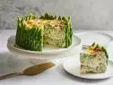 Description: Food Network Kitchen's 4-Cheese Garden Vegetable Frittata. Keywords: Cream Cheese, Goat Cheese, Chives, Parsley, Jumbo Asparagus, Heavy Cream, Parmesan, Mozzarella, Baby Spinach, Eggs, Scallions, Heirloom Grape Tomatoes.