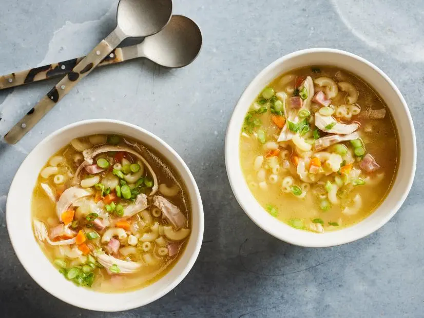 Description: Food Network Kitchen's Creamy Chicken Sopas. Keywords: Chicken Breasts, Carrots, Celery, Yellow Onion, Ham Steak, Garlic, Fish Sauce, Macaroni, Condensed Cream of Chicken Soup, Scallions.