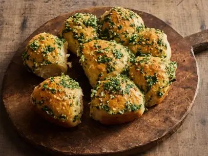 Description: Food Network Kitchen's Pampushky. Keywords: Egg, Garlic, Sunflower, Milk, Dry Yeast, Sugar, Parsley, Dill.