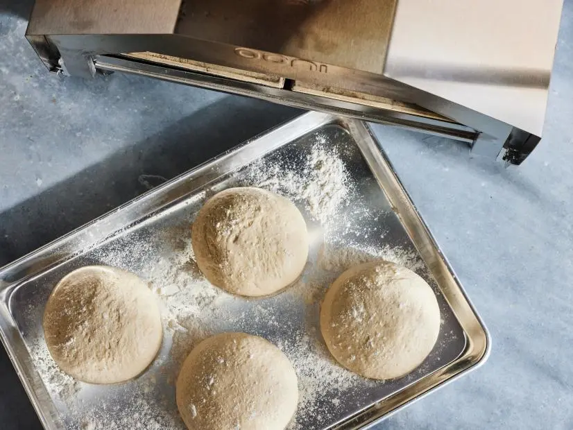 Description: Food Network Kitchen's Pizza Oven Pizza Dough. Keywords: Sea Salt, Instant Yeast, Flour, Olive Oil, Water.
