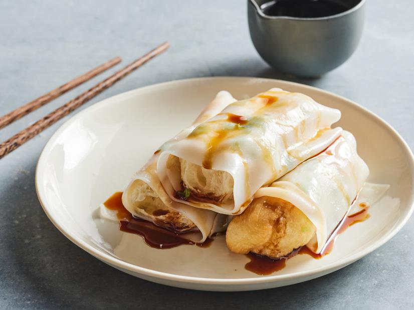 Description: Food Network Kitchen's Steamed Rice Noodles Wrapped Fried Dough. Keywords: Rice Flour, Tapioca Starch, Light Soy Sauce, Sugar, Sesame Oil, Scallions, Whole You Tiao.