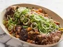 Description: Food Network Kitchen's Passover Brisket. Keywords: Brisket, Sweet Onions, White Wine, Thyme, Garlic, Pearl Onions, Leeks, Honey, Scallions, Shallot, Parsley, Mint.