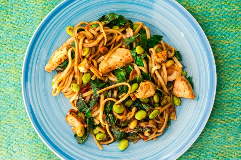 Chilli chicken noodles with edamame beans, cabbage and peanuts in a tamarind and chilli sauce.