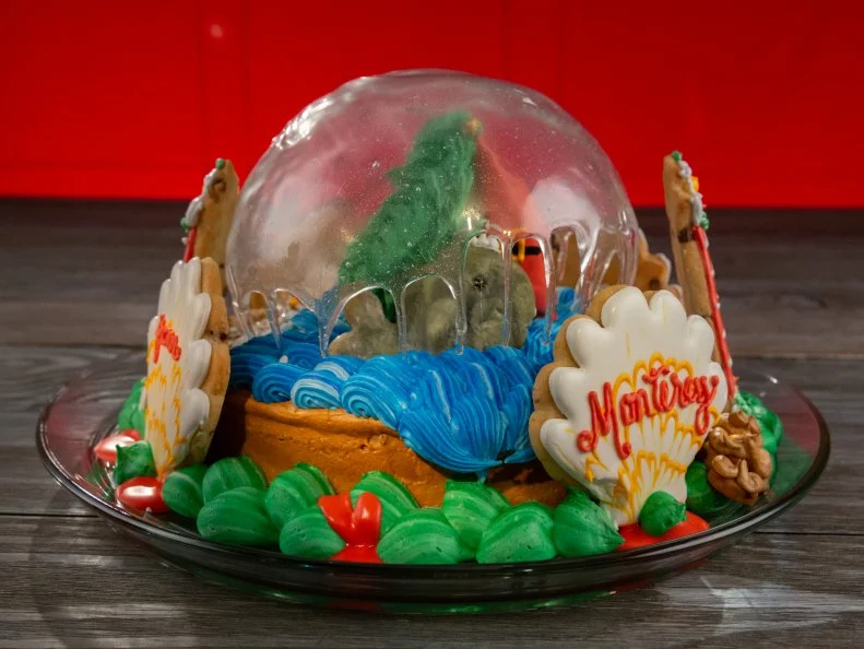 Baker Tammy Hunziker's R2 dish: DESIGN: Santa Sailing on Monterey Bay COOKIE: Blood Orange Chocolate Chip Cookie w/Vanilla Royal Icing, as seen on Christmas Cookie Challenge, Season 5