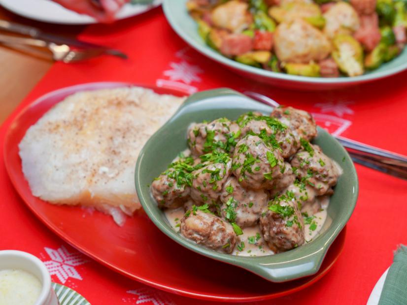 Beauty shot of Molly Yeh's Super Scandi Feast featuring her Meatballs & Lutefisk and Potato & Ham Dumplings with Brussel Sprouts, as seen on Girl Meets Farm, season 9.