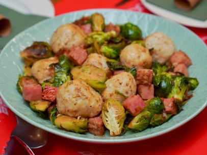 Beauty shot of Molly Yeh's Super Scandi Feast featuring her Potato & Ham Dumplings with Brussel Sprouts, as seen on Girl Meets Farm, season 9.