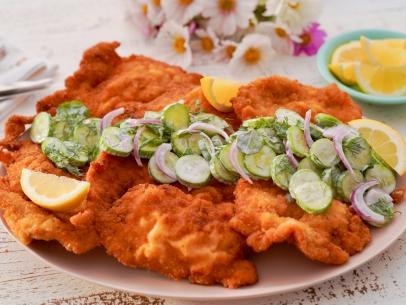 Beauty shot of Molly Yeh's Pork Schnitzel with Cucumber Salad, as seen on Girl Meets Farm, season 9.