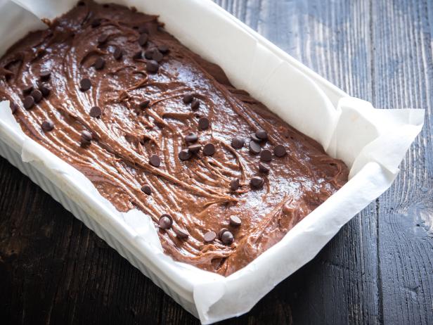 Basic homemade brownie or chocolate cake raw dough in baking pan. Cooking (baking) homemade chocolate cake or brownie.