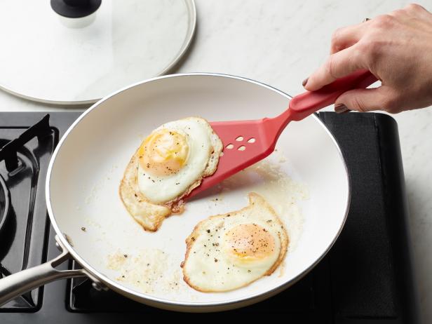 Food Network Kitchen’s How to Fry Eggs A Step By Step Guide Over Easy Eggs, as seen on Food Network.