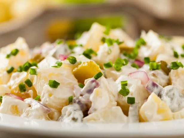 Traditional German potato salad with cucumber, onion and mayonnaise.