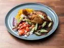 The Main Dish from the joint demo, featuring chicken in adobo sauce with green papaya salad and Filipino style fried rice with charred Japanese eggplant, as seen on Worst Cooks In America, Season 24.