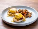 The dish from the Skill Drill Blue Team Demo, featuring eggs Benedict with smoked paprika hollandaise and potato hash, as seen on Worst Cooks In America, Season 24.