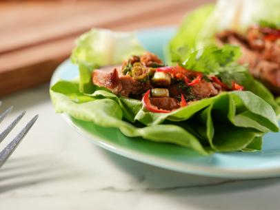 Alex Guarnaschelli makes her Spiced Pork Loin and Lettuce Wraps, as seen on The Kitchen, season 29.