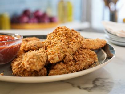 The Kitchen hosts share surprising substitutions and share these Cereal Crusted Chicken Fingers, as seen on The Kitchen, season 29.