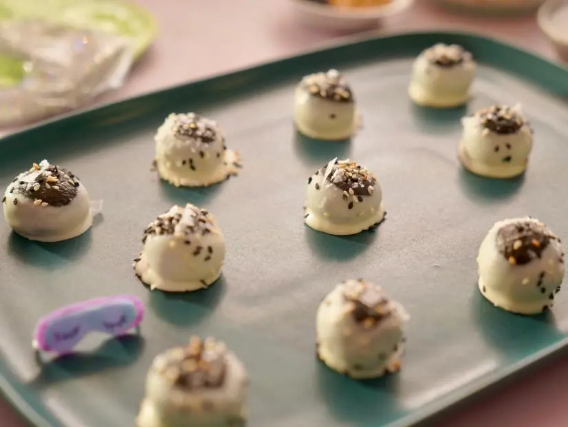Beauty shot of Molly Yeh's Black Sesame Buckeyes, as seen on Girl Meets Farm, Season 10.