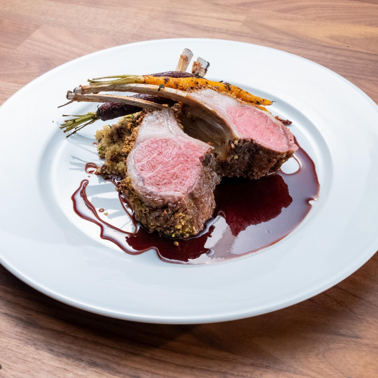 https://food.fnr.sndimg.com/content/dam/images/food/fullset/2021/12/16/0/WO2404_pistachio-crusted-rack-of-lamb-with-date-couscous-and-spiced-carrots-2_s4x3.jpg.rend.hgtvcom.1280.1280.suffix/1639686981077.jpeg