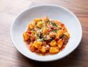 The Main Dish from the Red Team Demo, featuring ricotta gnocchi with tomato, pancetta, and corn, as seen on Worst Cooks In America, Season 24.