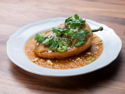 The Main Dish from the Blue Team Demo, featuring chile relleno with ground turkey and chili rojo, as seen on Worst Cooks In America, Season 24.