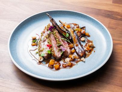 The Main Dish from the Blue Team Demo, featuring cumin and cilantro duck breast with apricot jus and Japanese eggplant, as seen on Worst Cooks In America, Season 24.
