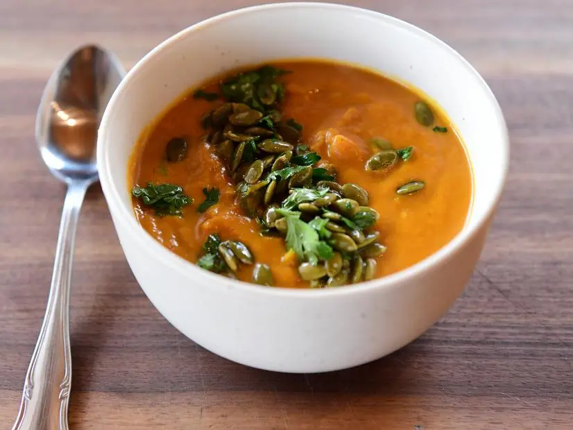 Close-up of Simple Curry Pumpkin Soup, as seen on The Pioneer Woman, season 30.