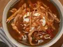 Sunny Anderson makes her Easy Chicken Tortilla Soup, as seen on The Kitchen, season 29.