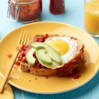 Food Network Kitchen’s Jammy Tomato Toast with Eggs and Avocado, as seen on Food Network.