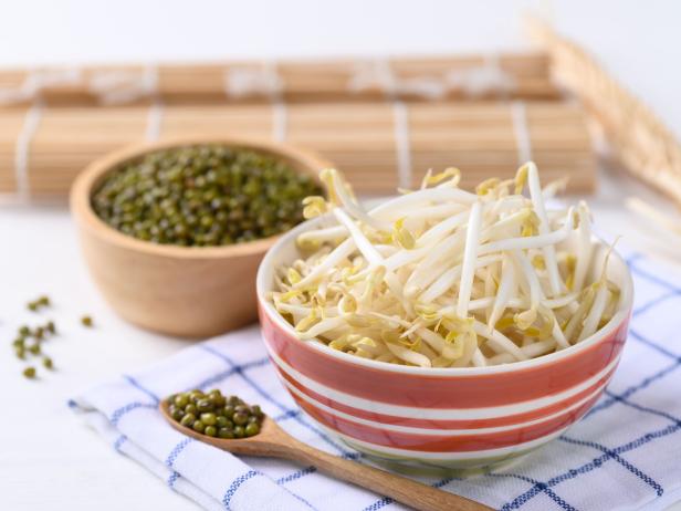 Fresh mung bean sprouts and mung bean seeds in a bowl, Organic vegetables and food ingredients in Asian food