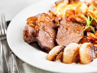 https://food.fnr.sndimg.com/content/dam/images/food/fullset/2022/01/10/rump-roast-sliced-onions-gravy-white-plate-fork.jpg.rend.hgtvcom.406.305.suffix/1641788124050.jpeg