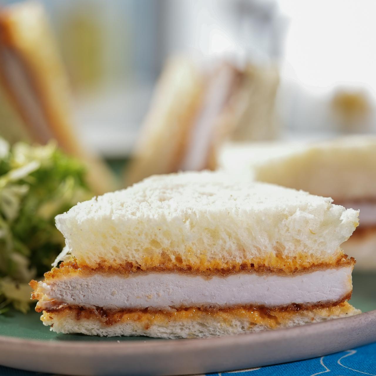 https://food.fnr.sndimg.com/content/dam/images/food/fullset/2022/01/11/0/KC2920_geoffrey-zakarian-pork-katsu-sando-with-hearty-winter-greens_s4x3.jpg.rend.hgtvcom.1280.1280.suffix/1641930485036.jpeg