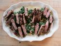 Close-up of Peppercorn-Crusted Steak with Pimento Creamed Spinach, as seen on the Pioneer Woman, season 30.