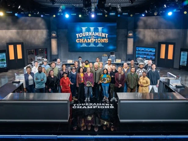 Host Guy Fieri with Contestants Tiffany Derry, Carlos Anthony, Eric Adjepong, Kelsey Barnard Clark, Brian Malarkey, Karen Akunowicz, Aaron May, Tim Hollingsworth, Einat Admony, Antonia Lofaso, Crista Luedtke, Bryan Voltaggio, Michael Psilakis, Shirley Chung, Joe Sasto, Tobias Dorzon, Brooke Williamson, Jet Tila, Chris Cosentino, Elizabeth Falkner, Maneet Chauhan, Tiffani Faison, Darnell Ferguson, Marcel Vigneron, Amanda Freitag, Christian Petroni, Phillip Frankland Lee, Madison Cowan, Justin Sutherland, Aarthi Sampath, Richard Hales, and Michael Voltaggio, as seen on Tournament of Champions, Season 3.