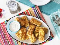 Crispy on the outside and tender on the inside, these not-so-chicken tenders satisfy that craving because the tofu is soaked in a "not chicken" broth, yielding an umami flavor. Don't be tempted to skip the pressing of the tofu&mdash;that's crucial in removing its liquid so it can soak up that broth.