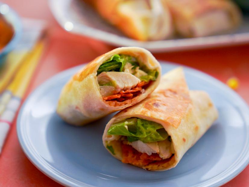 Beauty shot of Molly Yeh's Chicken Caesar Wraps with Crispy Cheese, as seen on Girl Meets Farm, season 10.