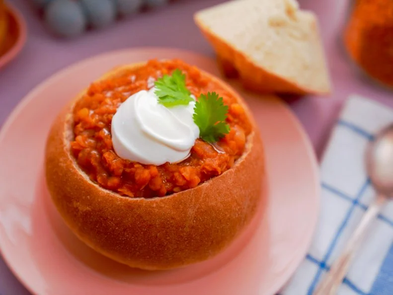 Beauty shot of Molly Yeh's Lentil Soup in Bread Bowls, as seen on Girl Meets Farm, season 10.